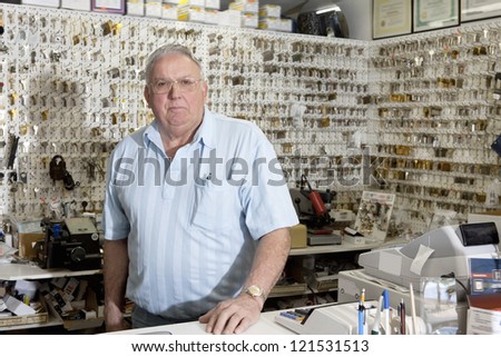 Portrait of locksmith in store