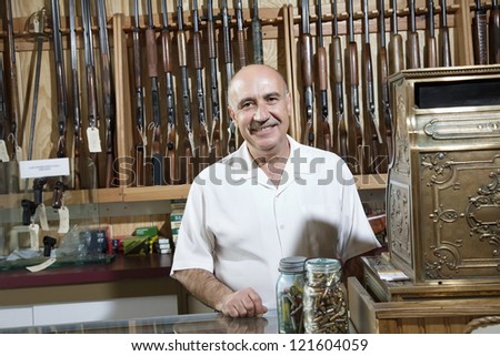 Portrait of a middle-aged merchant in gun shop