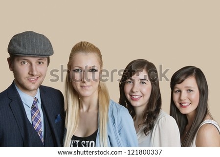 Portrait of young multi ethnic friends over colored background