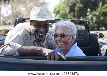 Portrait of happy African American couple in car