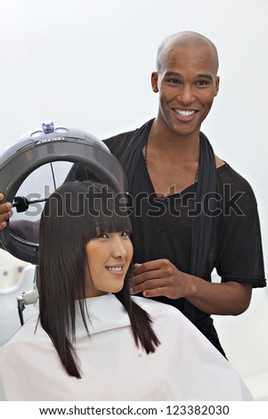 Asian woman getting herself groomed at hair salon