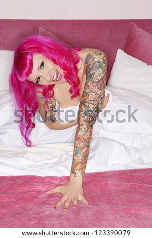 Erotic tattooed woman laughing