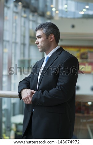 Businessman with serious expression looking off camera