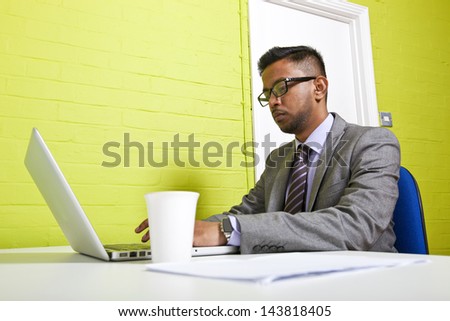 Indian businessman working at his desk