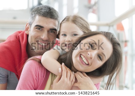 Young Happy Family In Shopping Mall