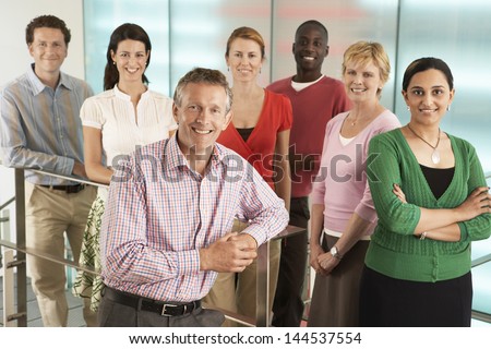 Group Portrait Of Multiethnic Business People Smiling In Office