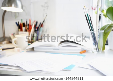 Artist\'S Desk With Books, Papers And Brushes