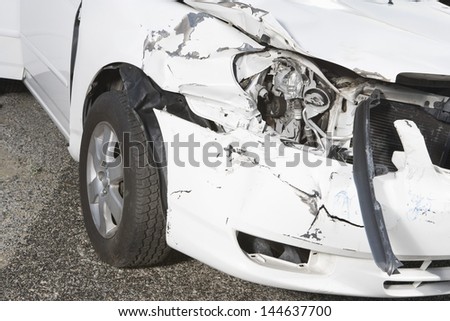 Closeup of a smashed car headlight on desert highway