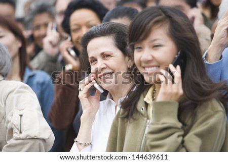 Closeup of crowd using mobile phones