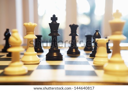 Chess pieces standing on chess board