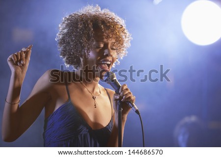 Beautiful Afro American jazz singer on stage