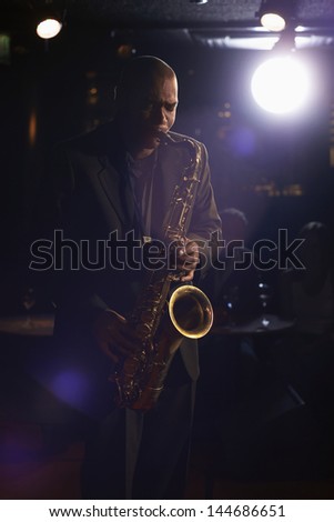 Musician playing saxophone in the jazz club