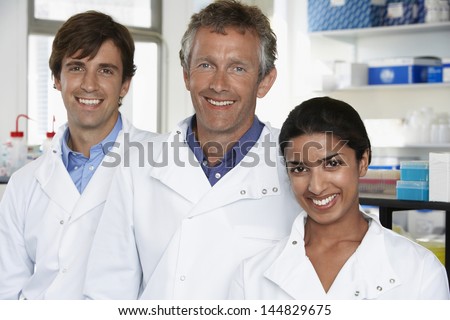 Multiethnic team of scientists smiling in laboratory
