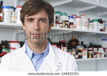 Portrait of confident male pharmacist in pharmacy