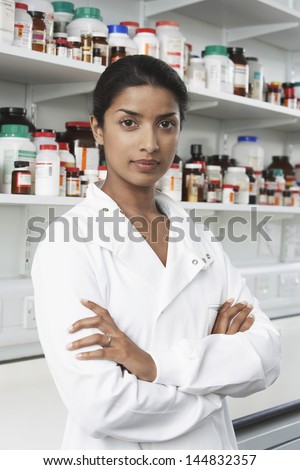 Portrait of confident female pharmacist in pharmacy