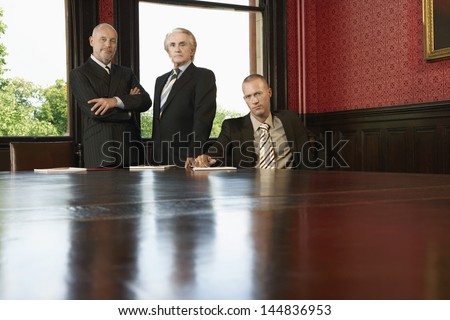 Portrait of confident businessmen at conference room