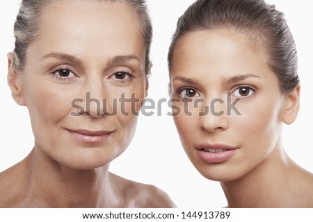 Closeup Portrait Of Two Women Of Different Ages On White Background