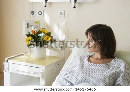 Female patient resting in hospital bed
