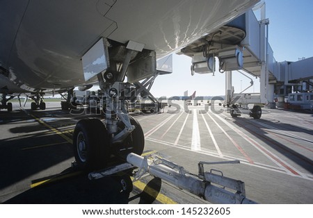 Close-up of airplanes wheel at airport