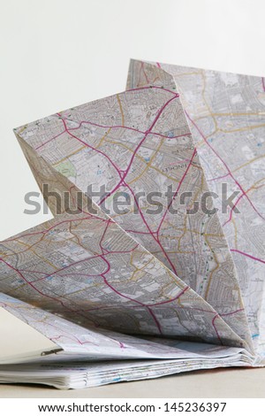 Map folded in fan shape studio shot