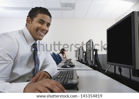 Man sitting at desk in front of computer