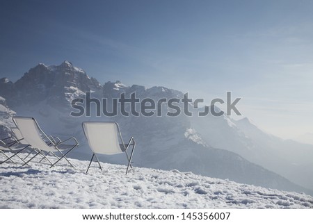 Lawn chairs on mountain peak