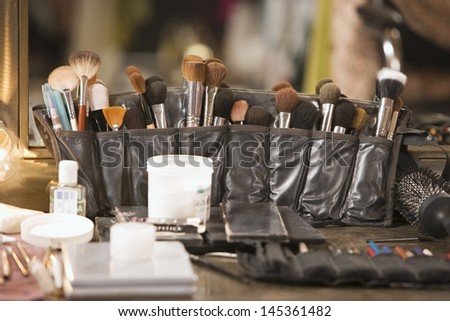 Professional cosmetics brushes on dressing table