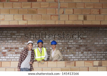 Portrait of multiethnic construction team at building site