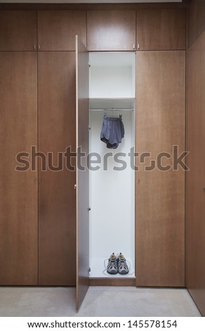 Athletic Shoes And Running Shorts In Wardrobe
