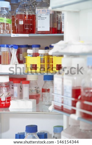 Closeup of chemical bottles on shelf in the laboratory