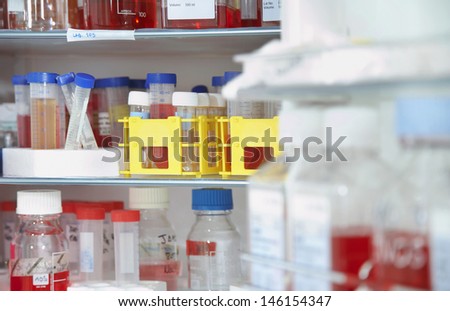 Closeup of chemical bottles on shelf in the laboratory