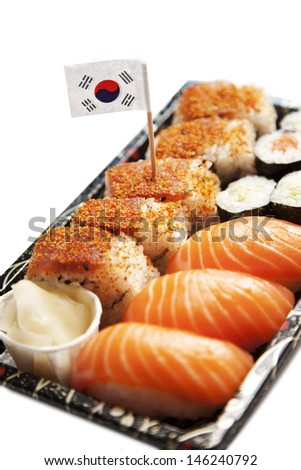 Sushi food on tray with Korean flag against white background