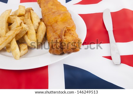 Cropped shot of junk food over British flag