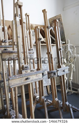View of group of easels in empty artist\'s studio