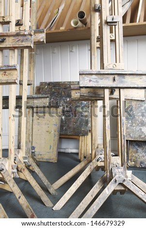 View of group of easels in empty artist\'s studio