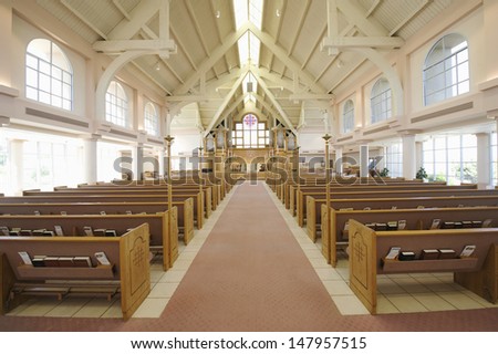 Interior View Of A Modern Church With Empty Pews