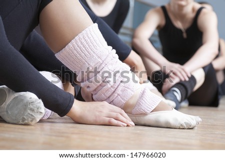 Low Section Of Women Relaxing In Ballet Rehearsal Room