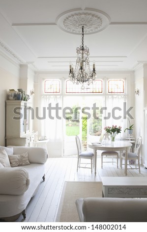 Interior Of Living Room With Sofa; Table; Chairs And Chandelier