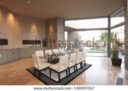 Spacious Dining Room With Floor To Ceiling Windows