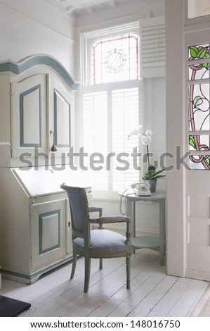 Writing bureau; chair and table by window at home