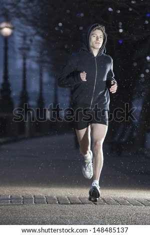 Full length of a male runner on early winter morning in London