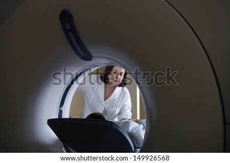 Female doctor examining patient before CT scan