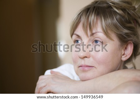 Closeup of a pensive middle aged woman