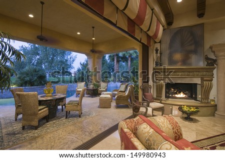 Open Plan Sitting Room By Lit Fire With View Of Porch