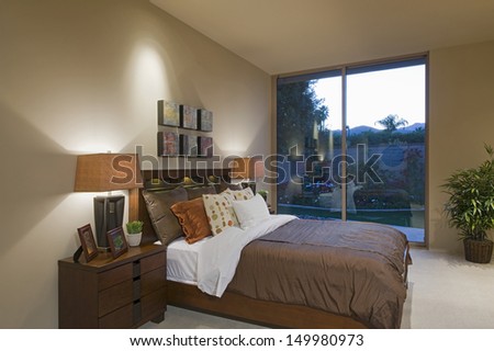 Matching bedside lamps at home with view of porch