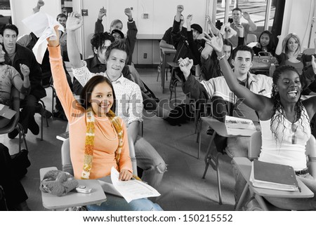 Diverse group of cheerful college students in classroom