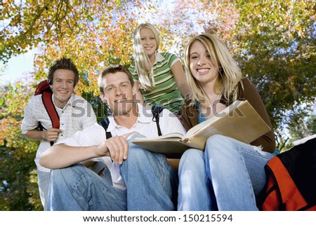 Portrait of young college students studying in campus