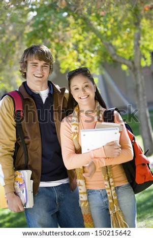 Portrait of smiling college students on campus