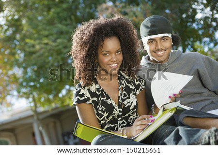 Portrait of African American students studying on college campus