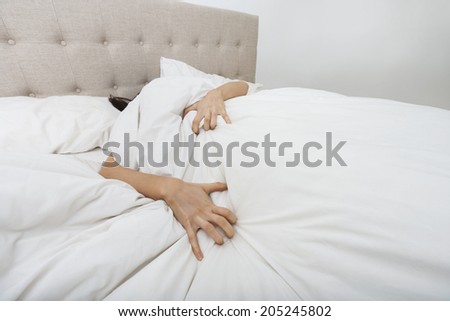 Sacred woman lying in bed